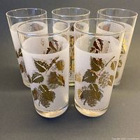 Front angled view of five frosted gold leaf tumblers