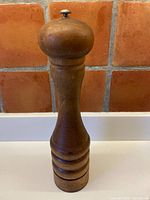 Full view of tall maple pepper grinder