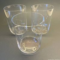Three clear Riedel tumblers standing