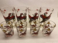 Front view of all eight glasses showing sizes and pheasant graphics