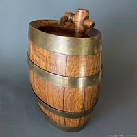 Front view of oak keg with brass bands and wooden spigot