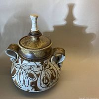 Front view of lidded pottery vessel