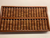 Full view of abacus showing frame, brass corners, bead layout