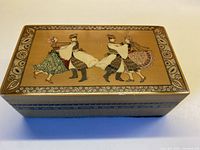 Top view showing full dancer scene and border on lid