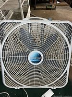 Front view of white Lasko WeatherShield box fan