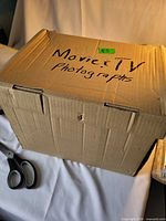 sealed cardboard box labelled Movie & TV Photographs