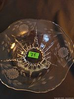 Top view of clear glass footed bowl with etched Cornflower pattern and scalloped rim