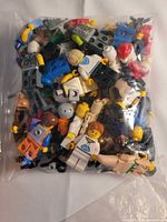 Bagged assortment of mixed Lego minifigure parts and accessories