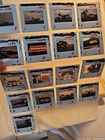 binder page containing 20 mounted 35 mm slides depicting Honda motorcycles