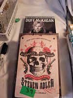 Both books stacked showing covers