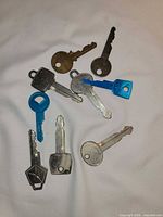 All nine keys laid out showing variety of head shapes and cuts