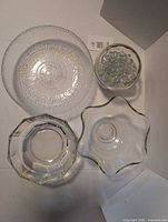 Top view of all four bowls and marbles inside small bowl