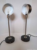 Front view of both lamps standing upright with bulbs installed