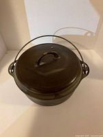 Cast iron Dutch oven with bale handle and lid