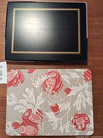 Top: black Pimpernel placemat; bottom: Williams Sonoma floral placemat
