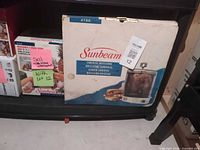 Front of Sunbeam 4780 box on shelf