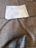 Overview of houndstooth fabric with size note