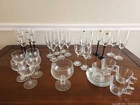 Full lot showing all 27 glass pieces on table