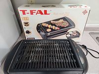 Grill with box visible
