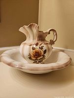 Pitcher resting in wash basin showing overall design