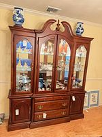 Full front view of American Drew cherry hutch showing glass door top and drawer base
