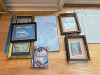 All six items laid out: four framed prints, unframed Giverny poster, ceramic tile