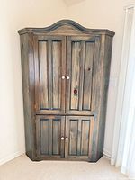 Front view of corner cabinet closed