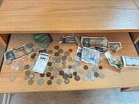 Drawer view showing full assortment of coins and banknotes