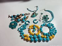 Overall view of all nine costume jewelry pieces