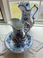 Full view of basin with two pitchers