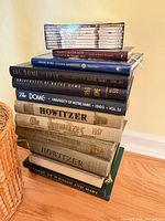 Full stack showing yearbooks, hardcovers and sealed DVDs