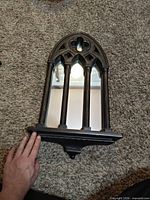 Front view of Gothic arch wall mirror with shelf ledge
