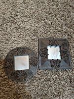 Round and square ornate mirrors front view