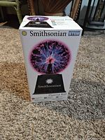 Front view of boxed Smithsonian plasma ball
