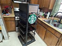 Front view showing shelves and logo