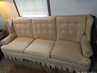 Front view of entire sofa showing upholstery pattern and cushions