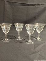 Four etched cordial goblets front view