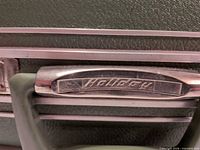 Close-up of handle showing Holiday logo