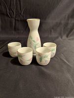 sake bottle and four matching cups