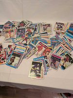 Spread of mixed O-Pee-Chee hockey cards on table