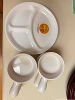 divided plate and two handled ramekins