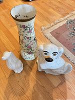 Overview showing vase and two dog figurines