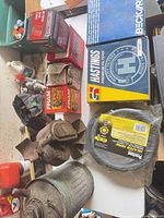 Overview of boxed filters, heater hose, brake caliper, metal component