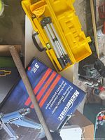 Boxed Mastercraft air-powered flooring stapler/nailer, yellow case with tripod visible