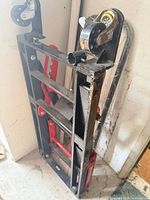 folded MotoMaster scissor lift jack standing upright
