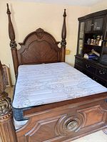 Full view of queen four-poster bed frame assembled