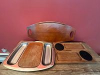 Front view of all three trays showing overall design and materials