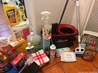 Group shot showing full assortment of cleaners, Vileda bucket and mop, Borax box, cloths and sponges