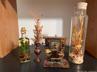 All four decor items side by side on shelf