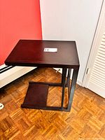 Full view of C-shaped side table angled